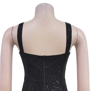 Detailed back view of black sequined dress featuring hidden zipper and wide straps