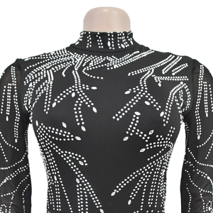 Detail of black turtleneck bodysuit with intricate silver rhinestone leaf patterns