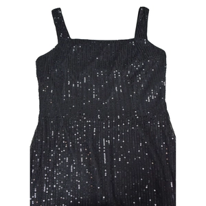 Detailed view of black sequins arranged in vertical stripes on a stylish cocktail dress