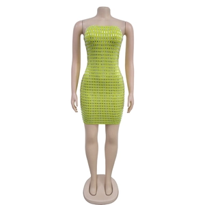Detail of neon green tube bodycon mini dress with vertical silver sequins and rhinestones