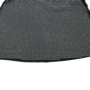 Close-up detail of silver rhinestones embellishment on black sleeveless dress fabric