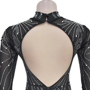 Detail of sheer black mesh bodysuit with silver rhinestones and a large open back cutout
