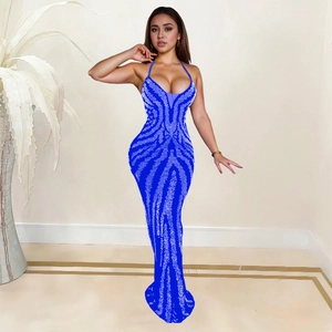 Detail of navy blue mermaid dress with rhinestone wave patterns and sheer V-neckline