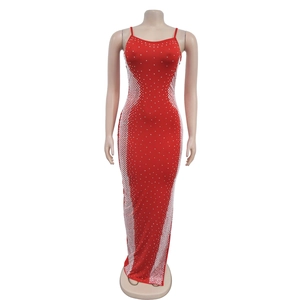 Detail of red slim fit maxi dress featuring sparkly rhinestone dots and mesh pattern