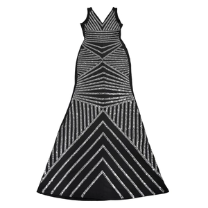Detail of elegant black sleeveless deep V-neck maxi dress with silver rhinestone patterns