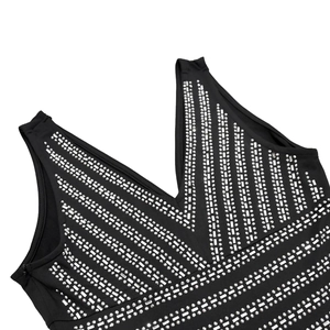 Detail of V-neckline with silver rhinestones and invisible zipper on black dress
