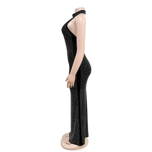 Close-up detail of silver rhinestones on backless black slim evening dress