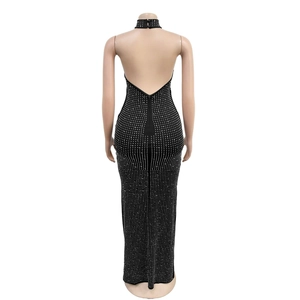 Detail view of backless design on black rhinestone evening gown for formal events