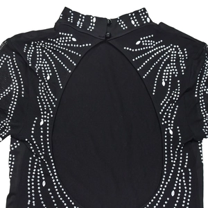 Detail of back cutout with rhinestones and mesh inserts on a black bodysuit