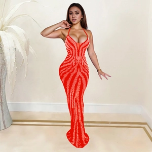 Detail of red backless halter evening dress with silver rhinestone wave pattern