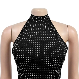 Detail of black halter top featuring shimmering silver rhinestones and a stand collar
