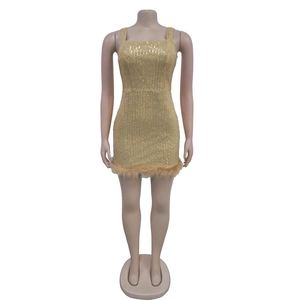 Detailed close-up of gold sequin mini dress featuring elegant faux fur hemline trim