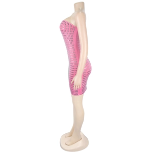 Detail of pink bodycon mini dress featuring silver rhinestone studs and backless design
