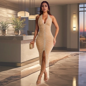 Detail of champagne gold bodycon dress with sparkling rhinestones and a side slit