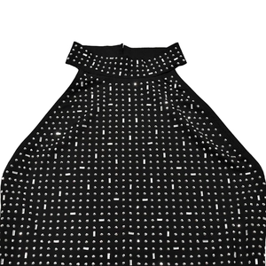Close-up of black backless dress showing rhinestone grid pattern and neck detail