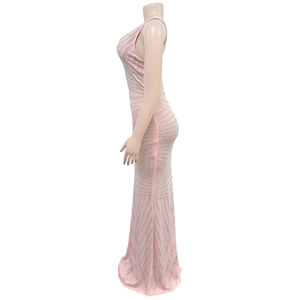 Close-up of pink slim-fit dress featuring shimmering silver rhinestones in geometric lines