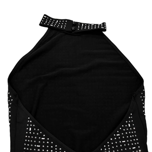 Detail of the high-neck halter collar with rhinestones and double button closure