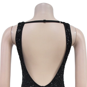 Macro detail of black sequin dress featuring an open back design and adjustable strap