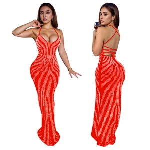Detailed view of red halter neck evening dress with backless criss-cross strap design