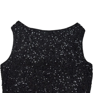Close-up of shimmering black sequins on elegant evening dress with round neckline