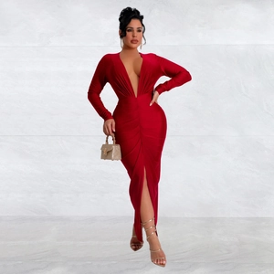 Detail of red slim fit V-neck dress with front slit and elegant waist pleats