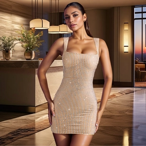 Close-up detail of champagne party dress with shimmering silver rhinestones and square neck