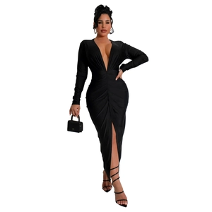 Detail of ruched waist and high slit on a slim fit V-neck long sleeve black maxi dress