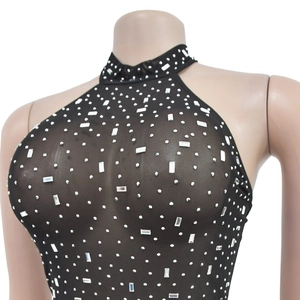 Detailed view of silver rhinestones and sequins on black mesh halter neck dress