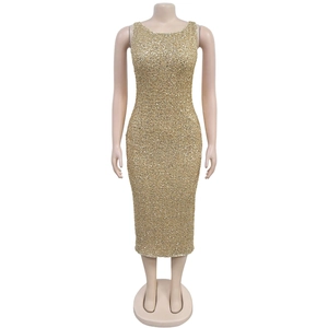 Detail of elegant gold sequin sleeveless evening dress on mannequin with metallic shine