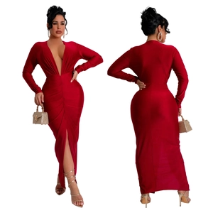 Detail view of deep red V-neck maxi dress with waist pleats and front high slit