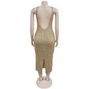 Detailed back view of gold sequin midi dress with deep U-shape backless design and slit