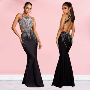 Elegant black fishtail evening gown with halter neck and sparkling rhinestones