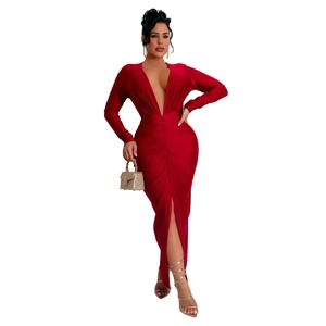 Detailed close-up of a red V-neck long-sleeve dress with ruching and high leg slit