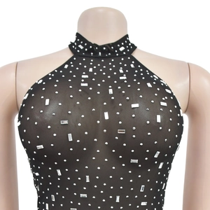 Detail of black mesh halter dress featuring sparkling rhinestones and crystal embellishments
