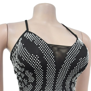 Detailed view of black camisole dress with silver rhinestones and mesh patchwork