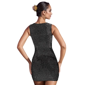 Close-up of black and white checkered dress with rhinestone detail and bodycon fit