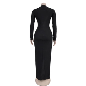 Rear view of a tight black long-sleeve maxi dress showing slim fit and ankle-length cut