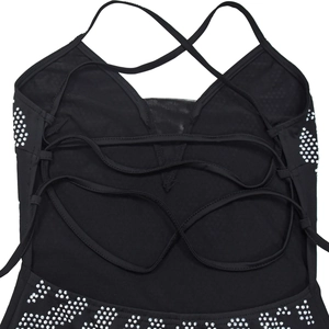Close-up of black backless dress with criss-cross straps and sparkling rhinestones