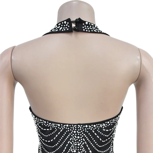 Detail of the back neck closure with two black buttons and silver rhinestones on dress