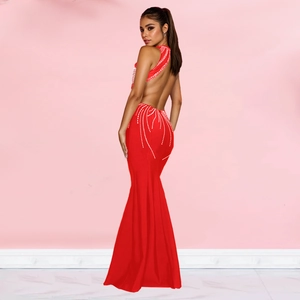 Detailed back view of red backless mermaid evening gown featuring white rhinestone accents
