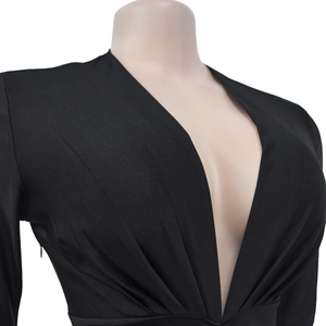 Detail of V-neckline and ruched waist on black long sleeve slim-fit dress