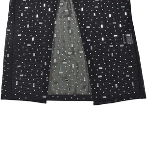 Detail of black mesh fabric featuring silver rhinestones and crystal embellishments