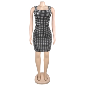 Close-up of black bodycon dress with square silver rhinestone pattern for parties