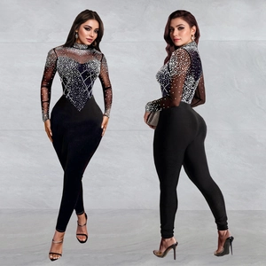 Sleek black mesh jumpsuit for women featuring sparkling rhinestones and a slim fit design