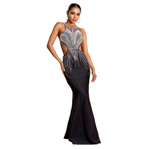 Detail of elegant black fishtail dress with sparkling silver rhinestones and cut-outs