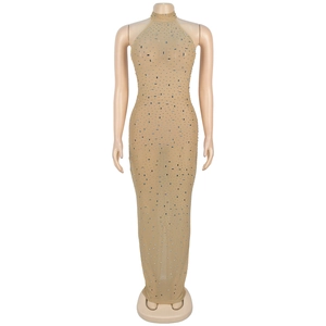 Detail of champagne gold halter neck dress featuring sparkling silver rhinestone patterns