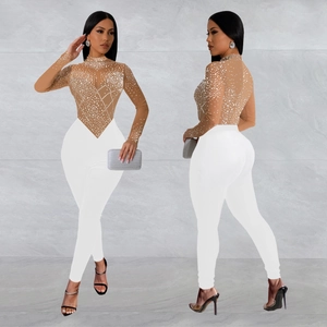 Women mesh long sleeve jumpsuit with rhinestone pattern and slim fit white trousers