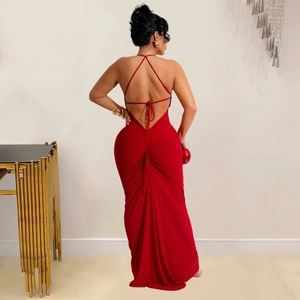 Detail of red backless evening dress featuring halter straps and elegant ruched waist design