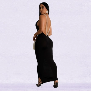 Close-up of elegant black backless dress with layered pearl straps and slim fit design