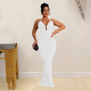 Close-up of the deep V-neckline with a metal ring connector on a white evening dress